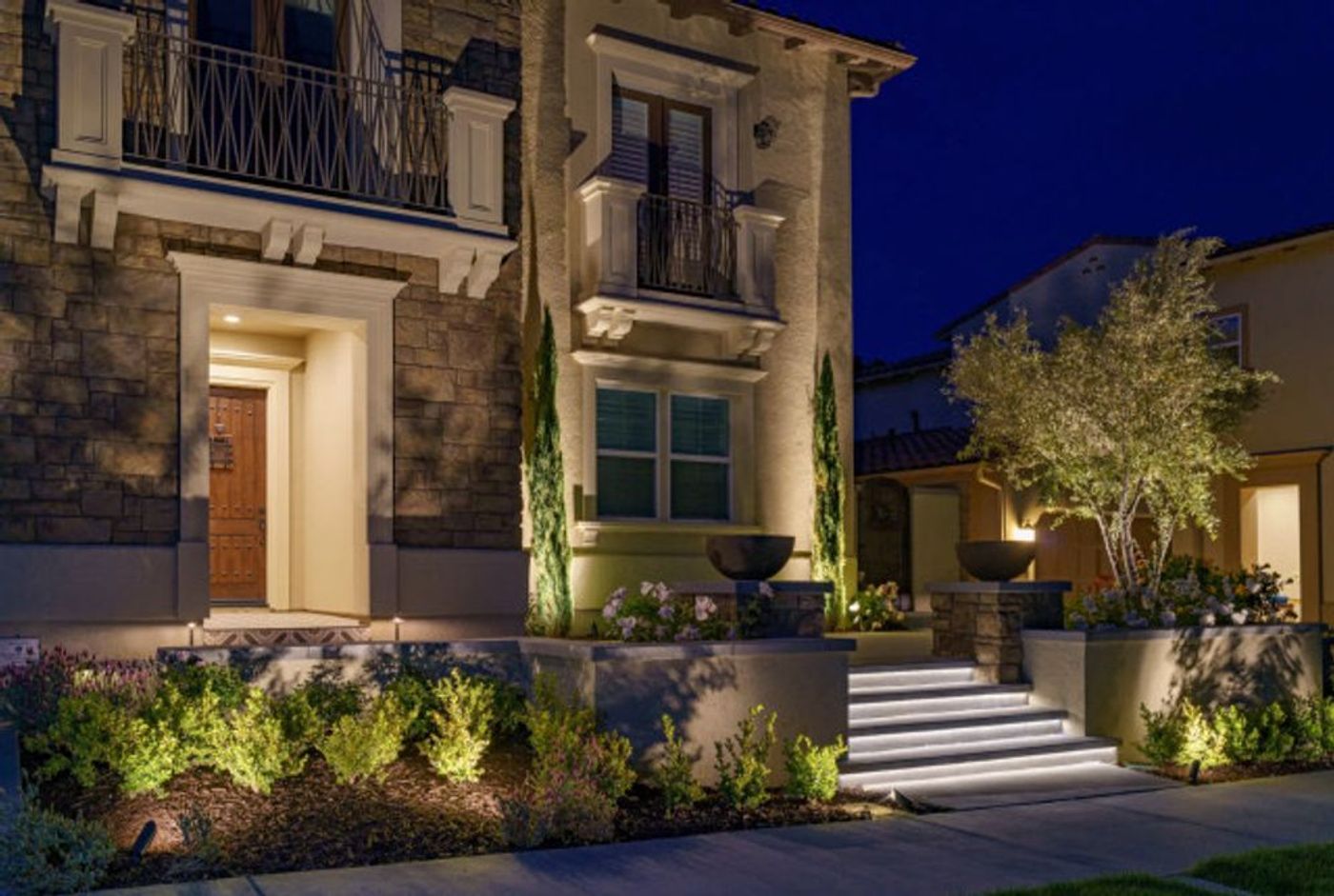 Luxury San Diego backyard hardscape with pavers, firepit and outdoor living space by Majestic Hardscapes