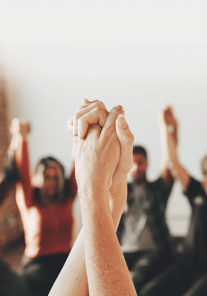 diverse people holding hands