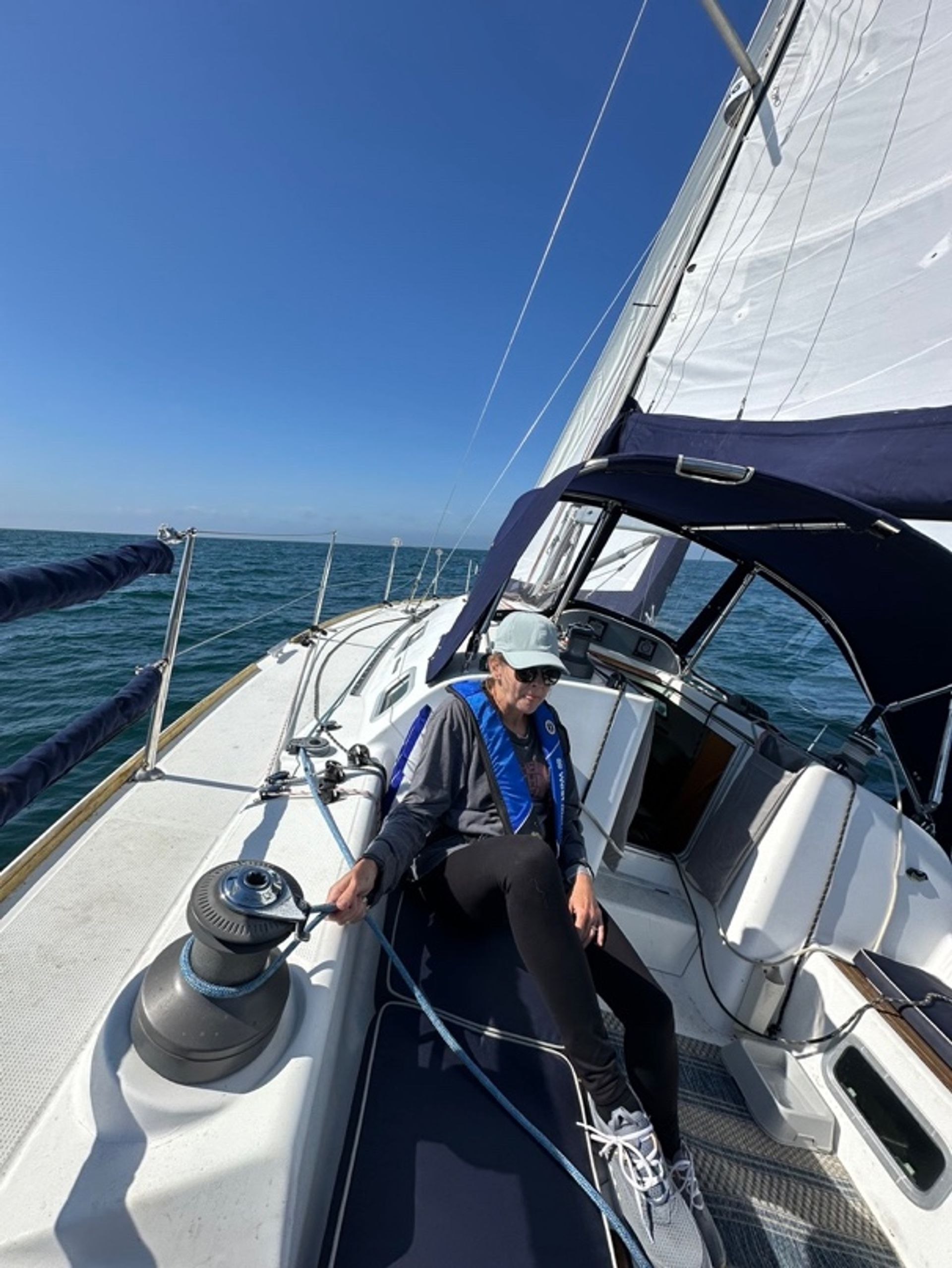Melanie resting in the cockpit underway