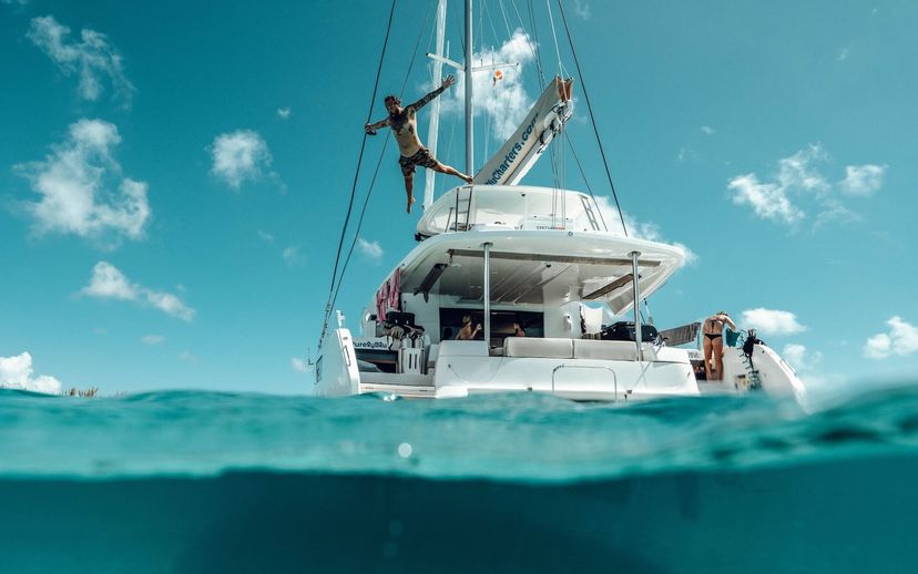 Sailors preparing a Beneteau multihull for departure