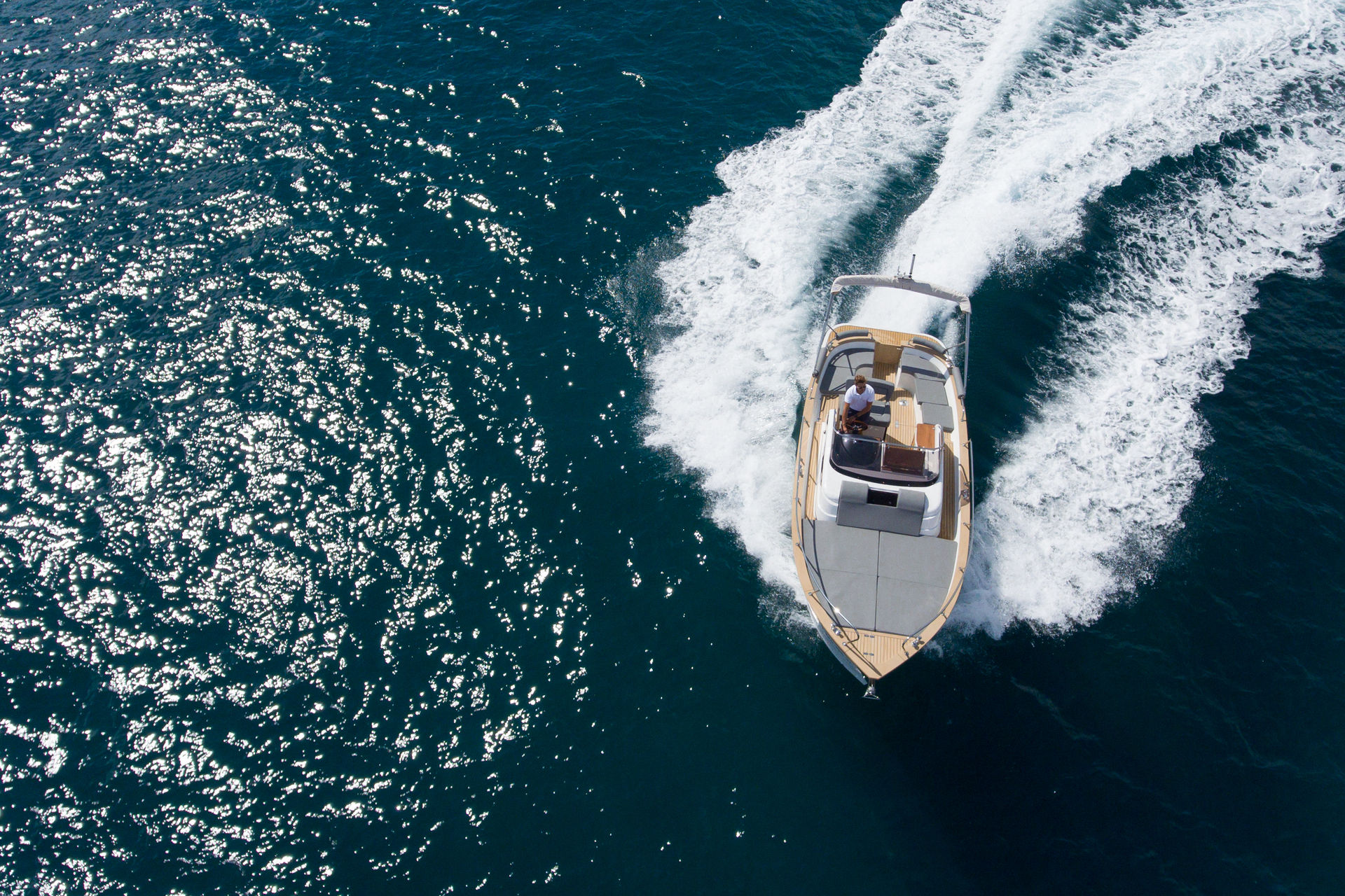 Drone top view of a luxury powerboat sailing in Marina del Rey.