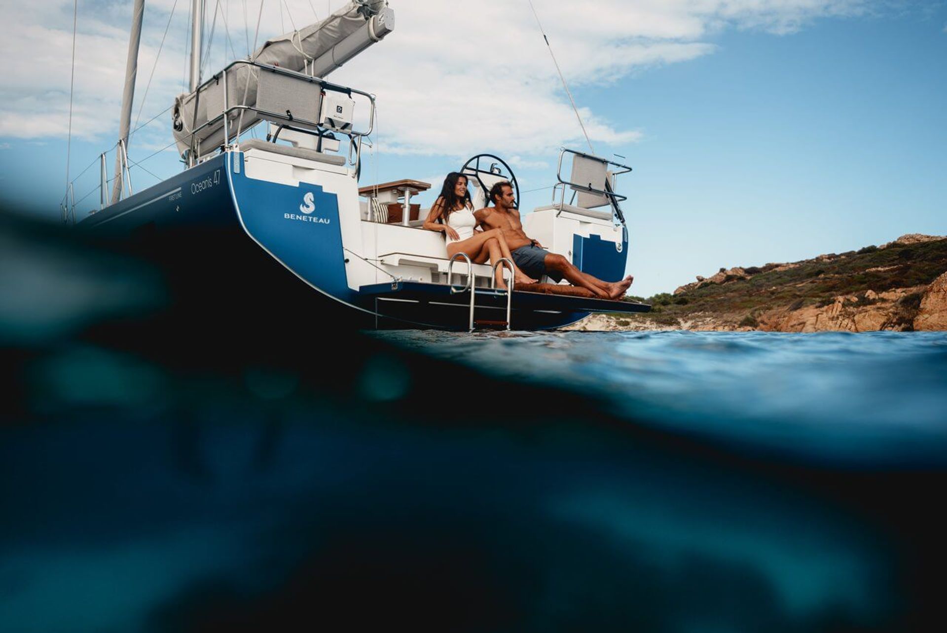 Beneteau Oceanis 47 sailing in Sardinia, exterior lifestyle view.