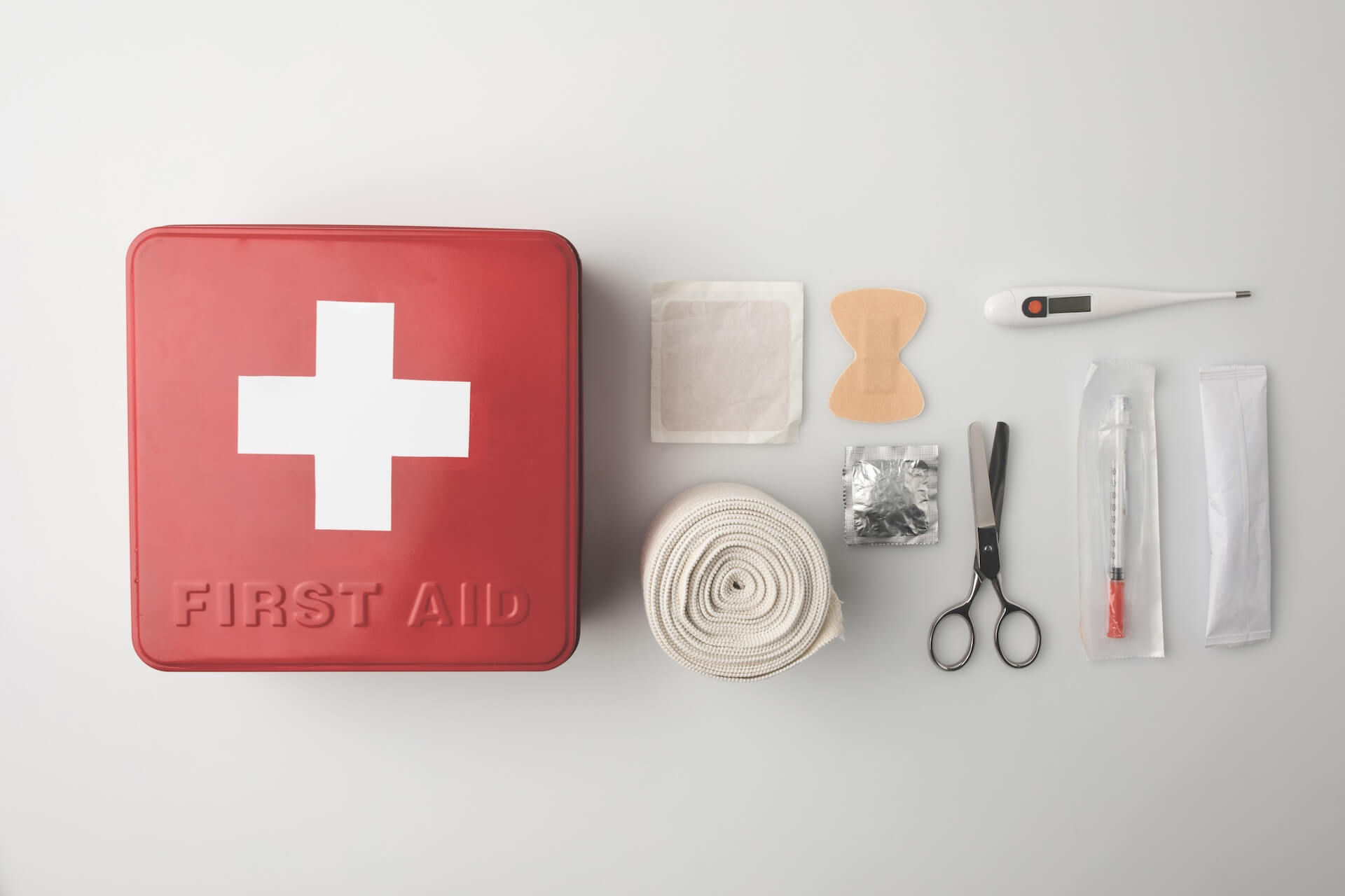 Top view of first aid kit with patch scissors.