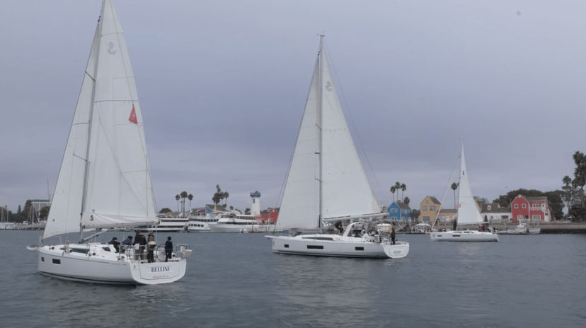 Sailing yacht navigating Marina del Rey waterways on a sunny day
