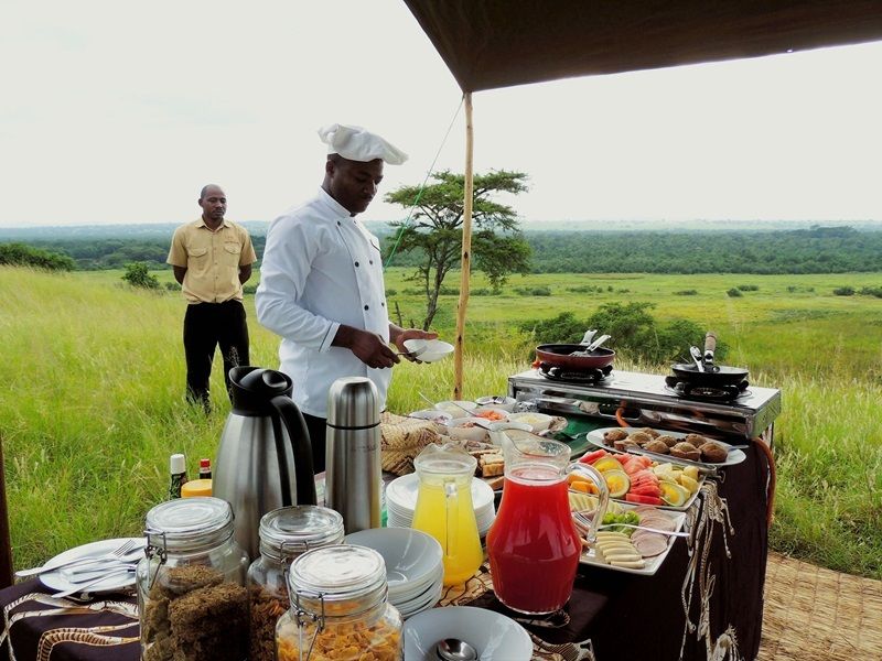 A savannah breakfast at Ishasha Wilderness Camp, Uganda. Day on an African Safari.