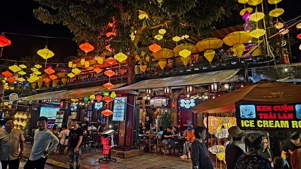 The bustle and colours of Hoi An by night.