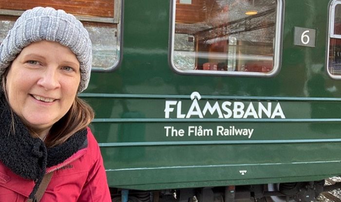 Travel agent Linda Forster boarding the Flam Railway on her holiday through Norway.