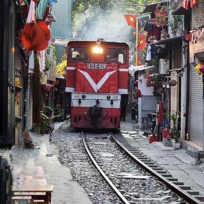 Train approaches on Train Street, Hanoi.