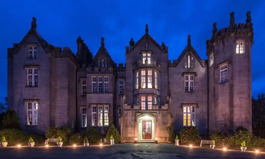 Kinnity Castle by night. Stay in a haunted castle! Unique stay accommodation. Travel Agent Finder