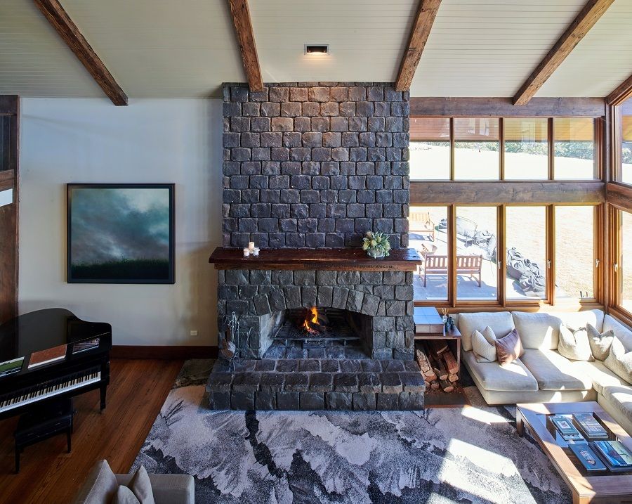 Central fireplace in the main lounge area at Spicers Peak Lodge, Scenic Rim Australia