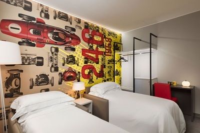 Image of the Hotel Maranello Village's quad room, copyright Marinello Village.