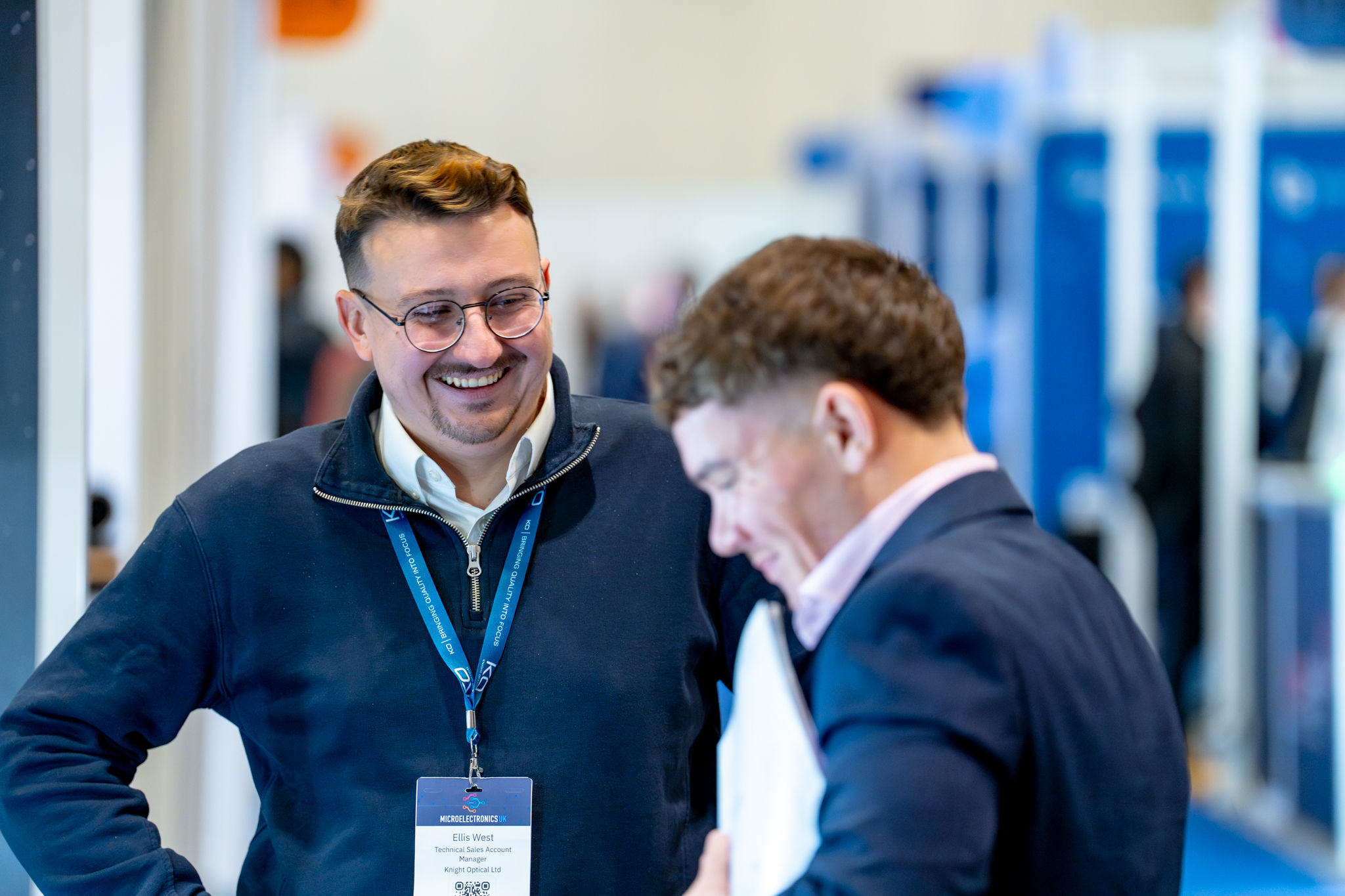 Exhibitor talking to a visitor