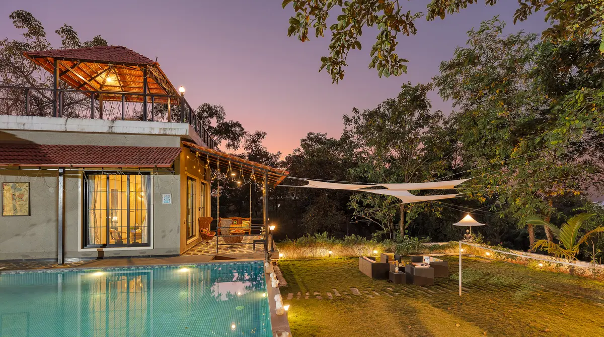 Take a refreshing swim in the pool while enjoying the lush greenery around