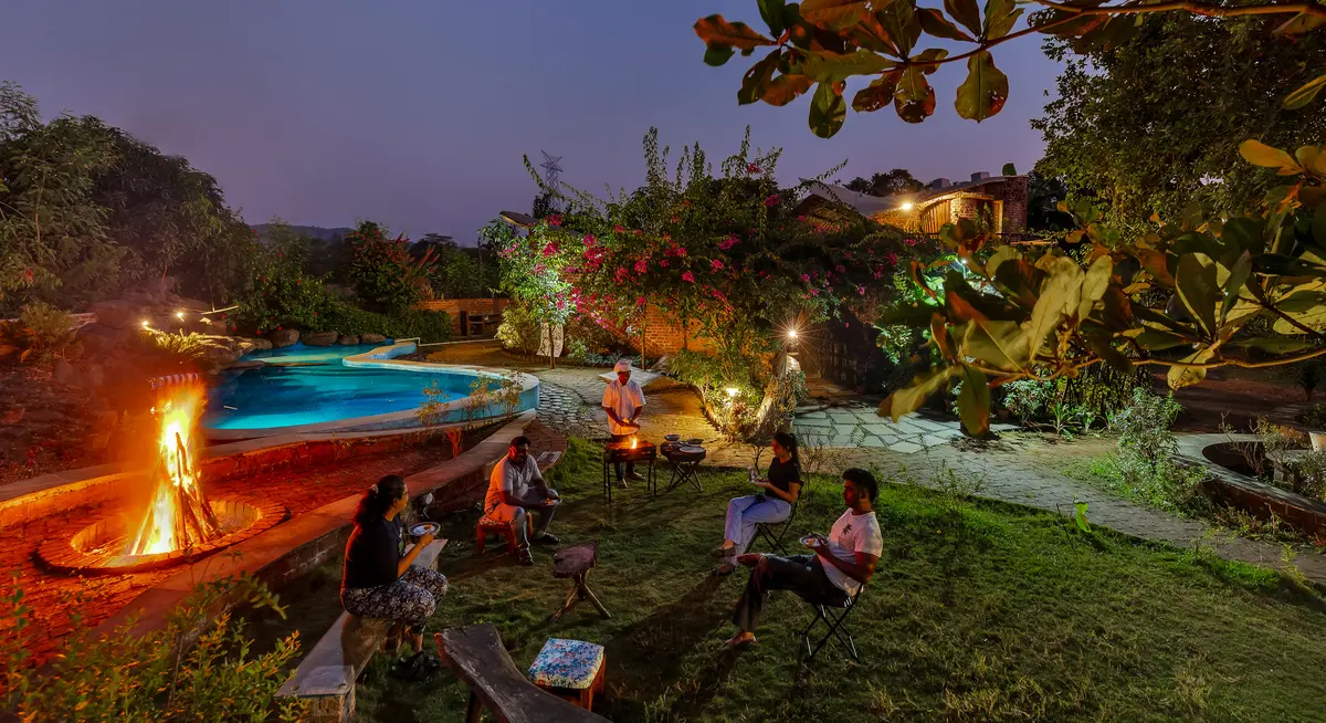 Gather around a cozy bonfire and relish a delicious barbecue under the open sky.