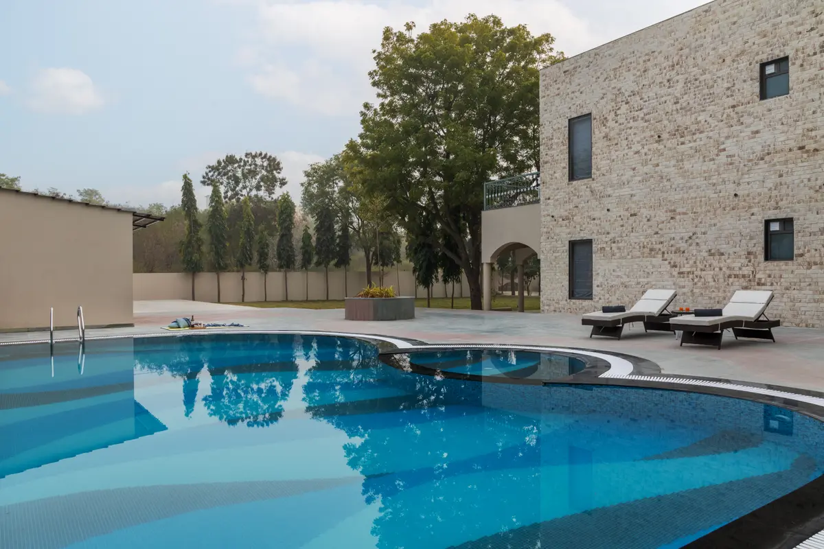 Dive into relaxation with a refreshing swim, perfect for family fun.