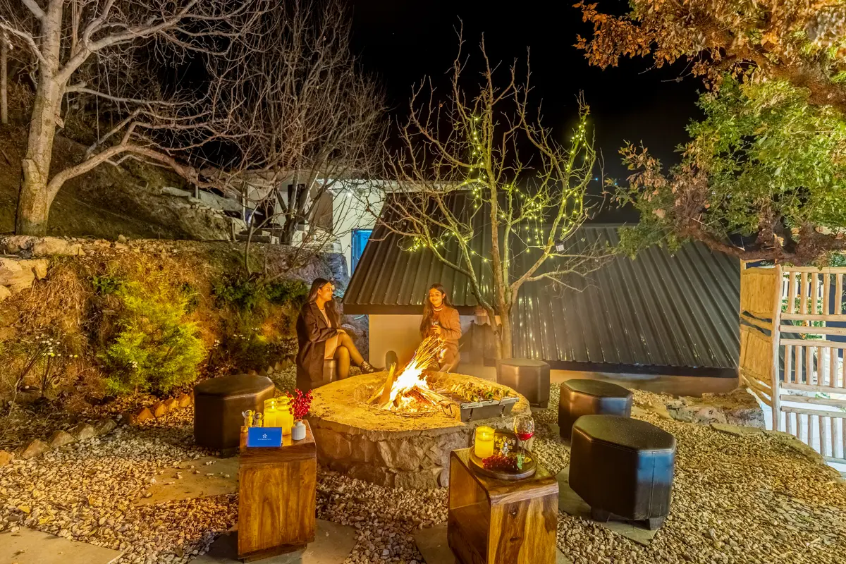 Warm your evenings with a crackling bonfire under the starlit sky.