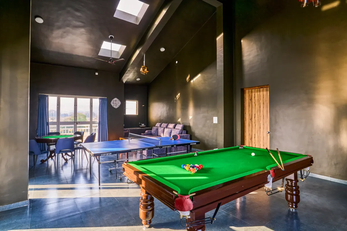 Game on! Unwind with snooker, poker table tennis, and endless fun in this stylish game room.