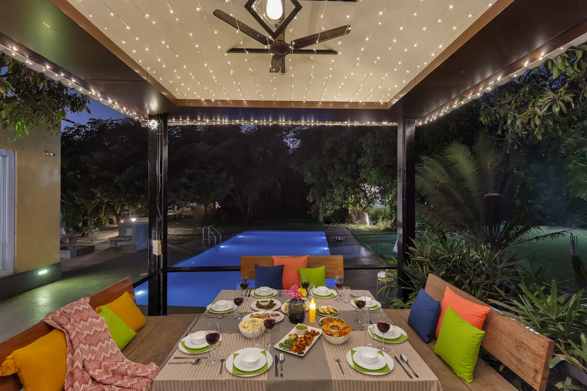 Enjoy a lovely outdoor dinner under twinkling fairy lights in the cozy gazebo