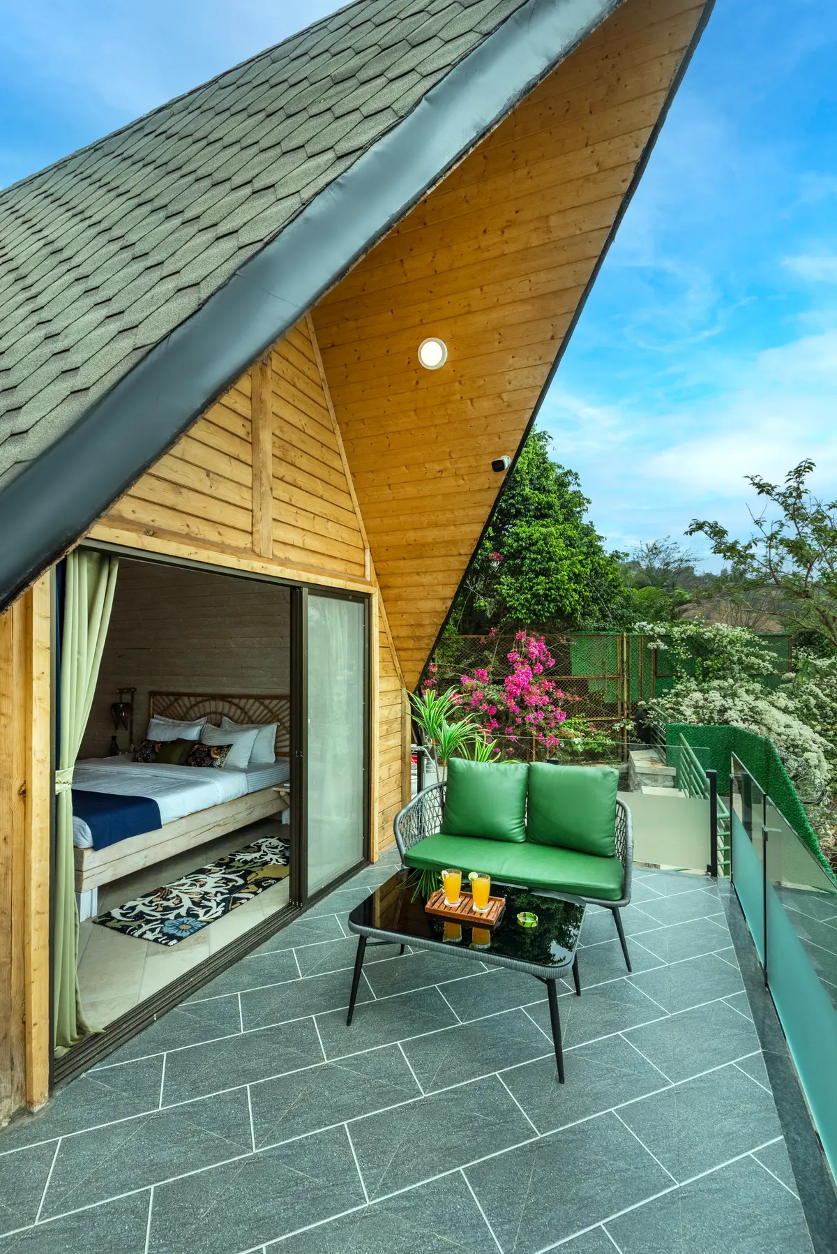 Triangular-shaped cottage bedrooms offering lake views