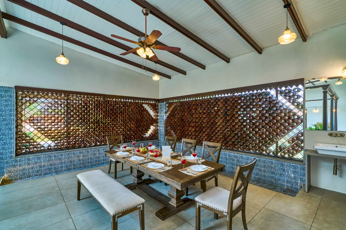 The dining area features beautiful earthen pots placed in the windows, working as natural coolers that bring in a soft breeze and keep the space refreshingly pleasant.