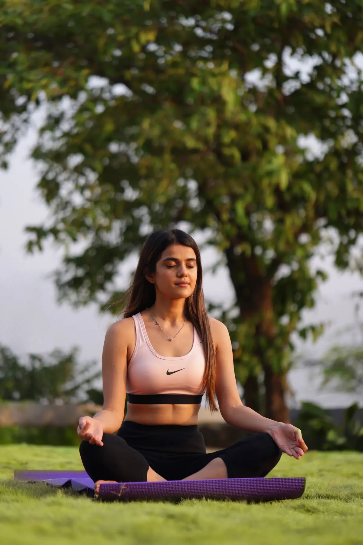 Reconnect with yourself through peaceful yoga sessions amidst lush greenery.