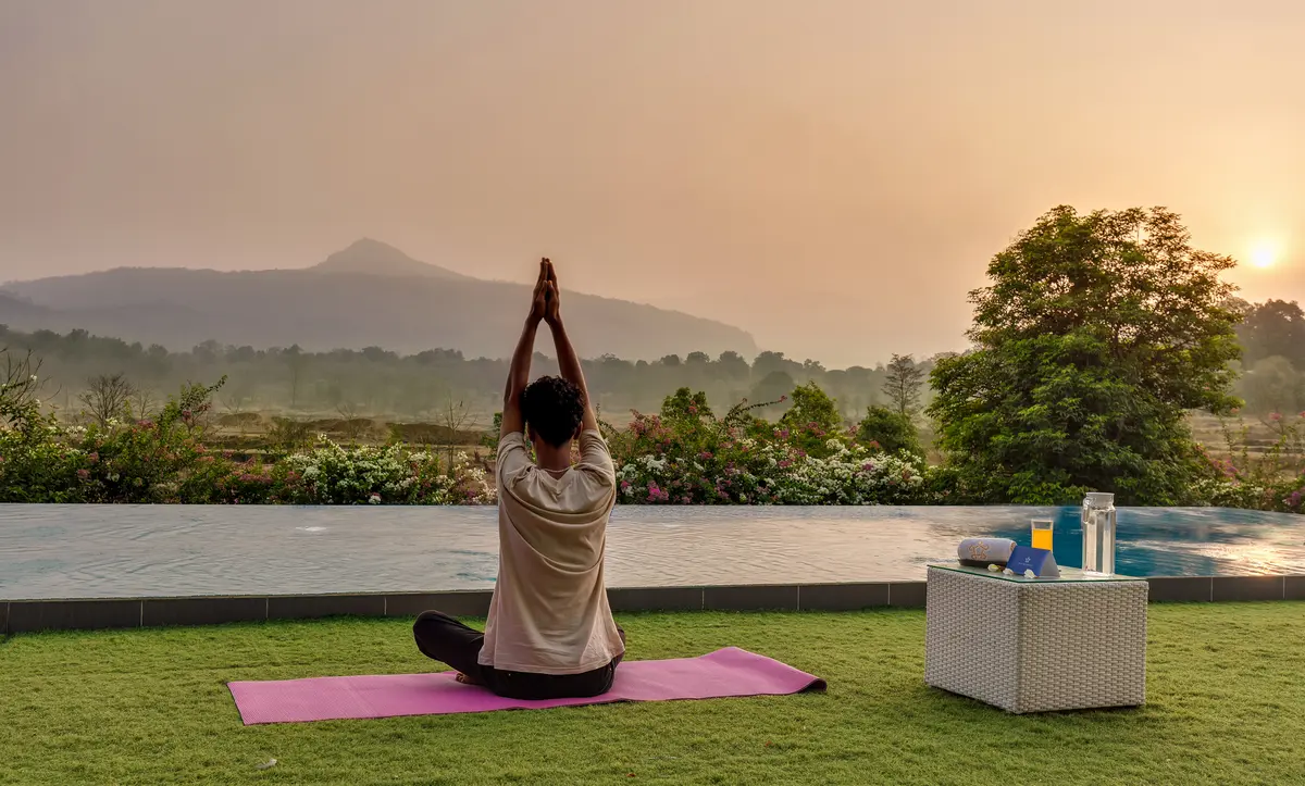 Meditate or practice yoga with a serene, lush green view.