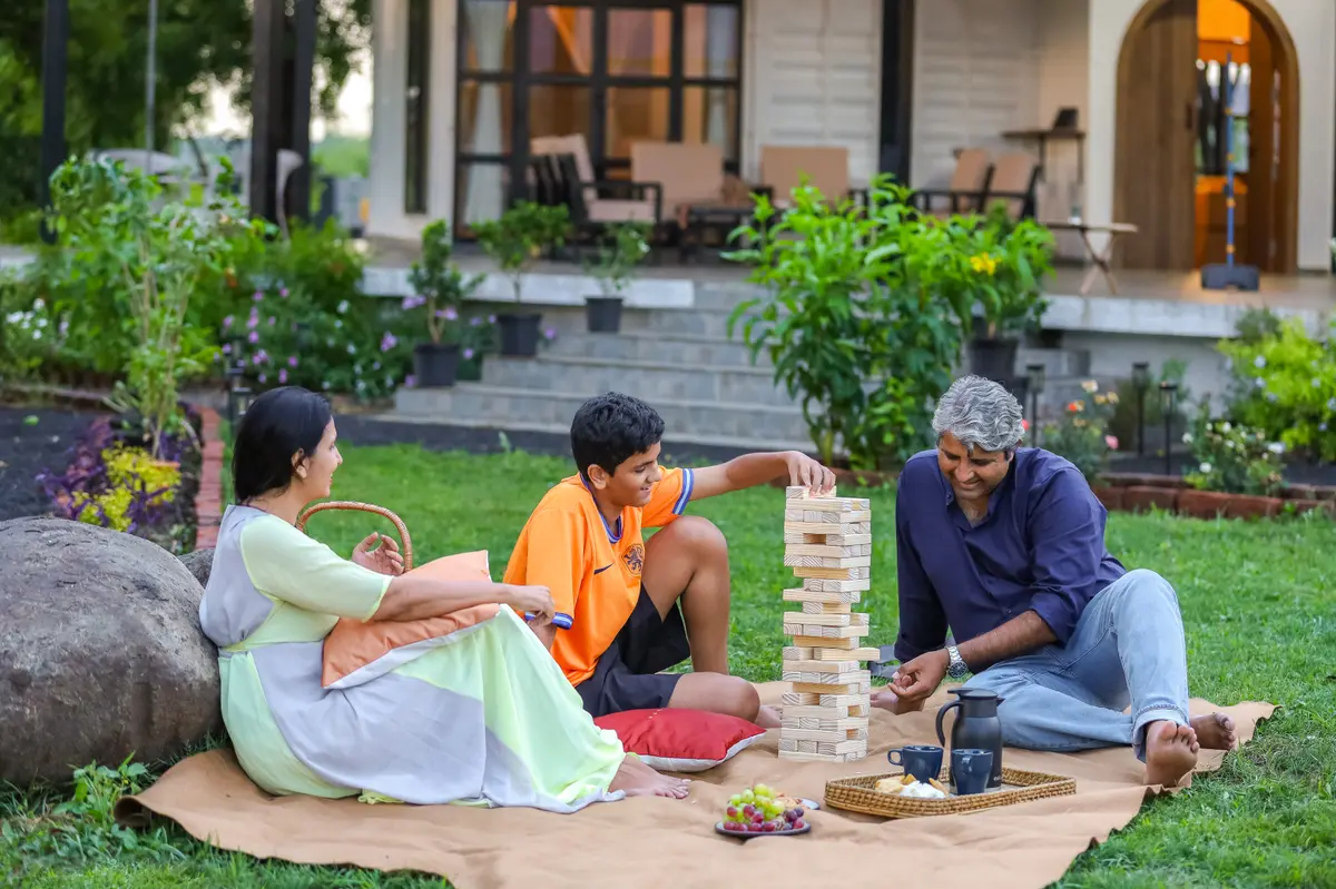 Whether it's Jenga battles on the lawn or sharing laughter over hot chai and fresh fruits, this is what quality time looks like