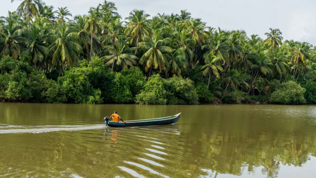 Watch local boats glide by, right from your riversong deck by the Suvarna River.