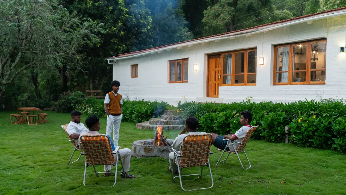 Share a heartfelt conversation by the bonfire, with warmth in the flames.