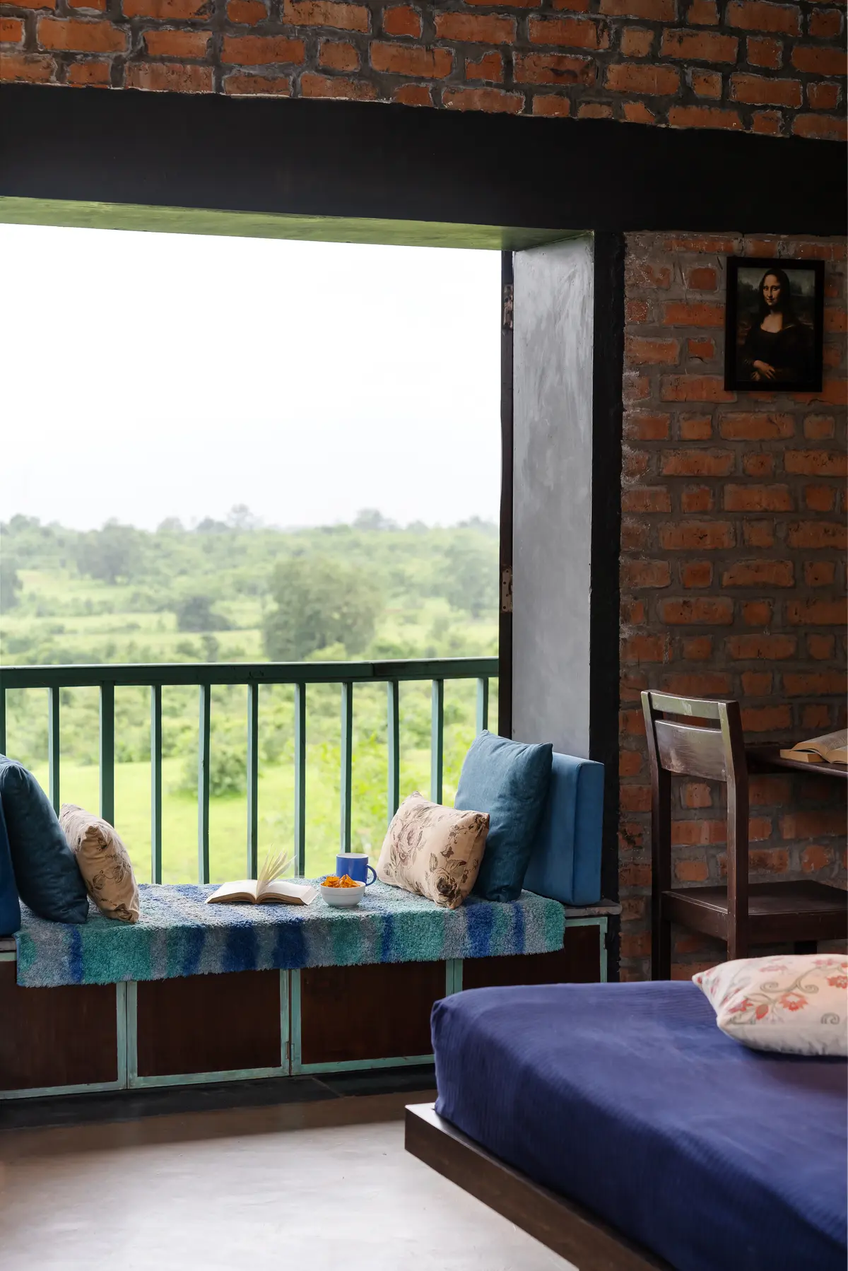 A cosy little corner with a beautiful green view—perfect for reading, relaxing, and sipping on a warm cup of chai.