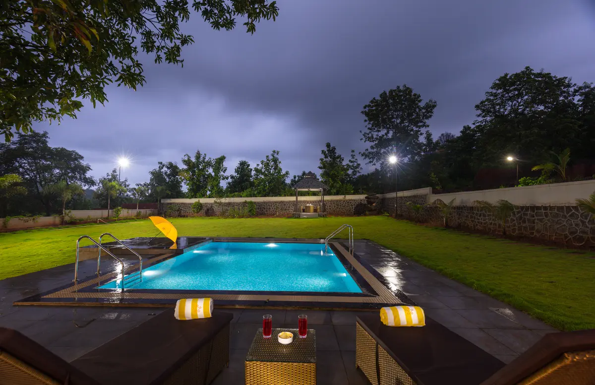 Take a peaceful evening dip in the swimming pool, as the sky turns golden and serenity takes over.