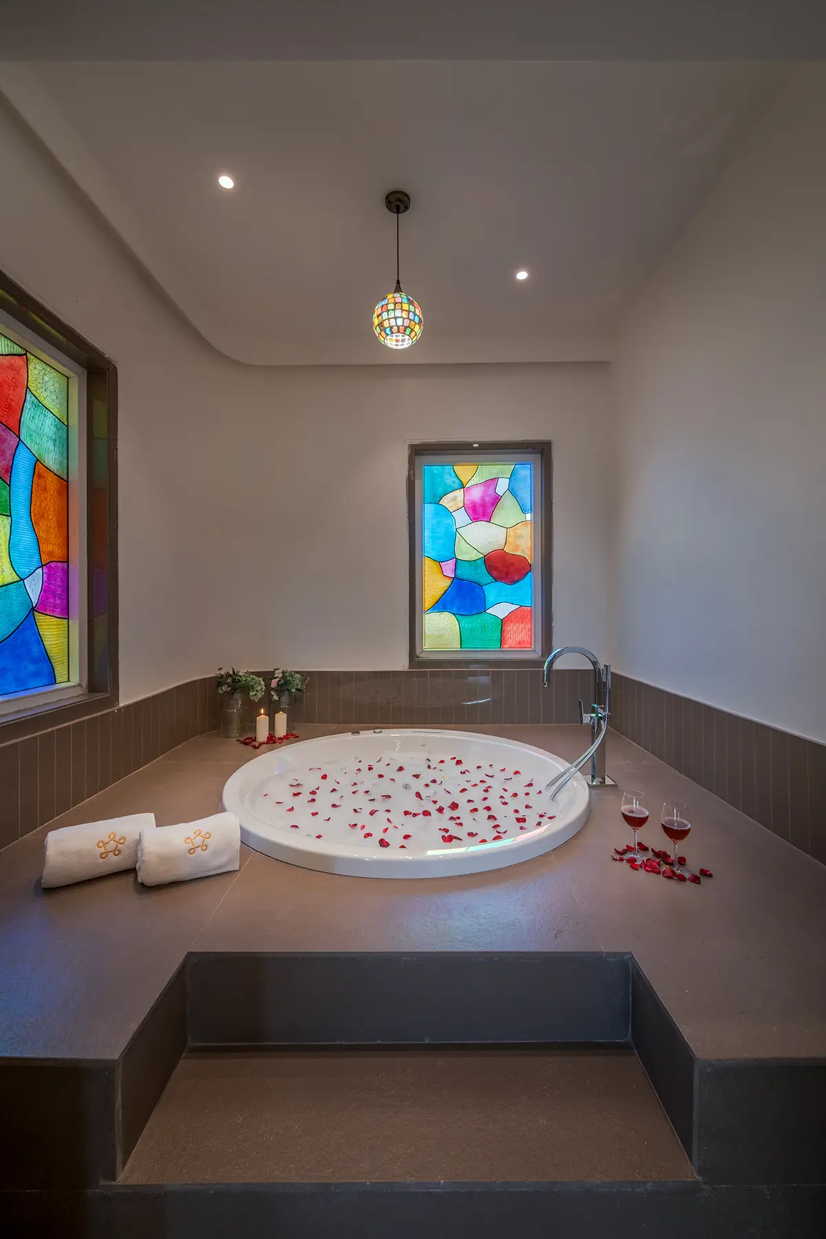 Unwind in your private in-room jacuzzi, sipping wine as you soak in pure relaxation.