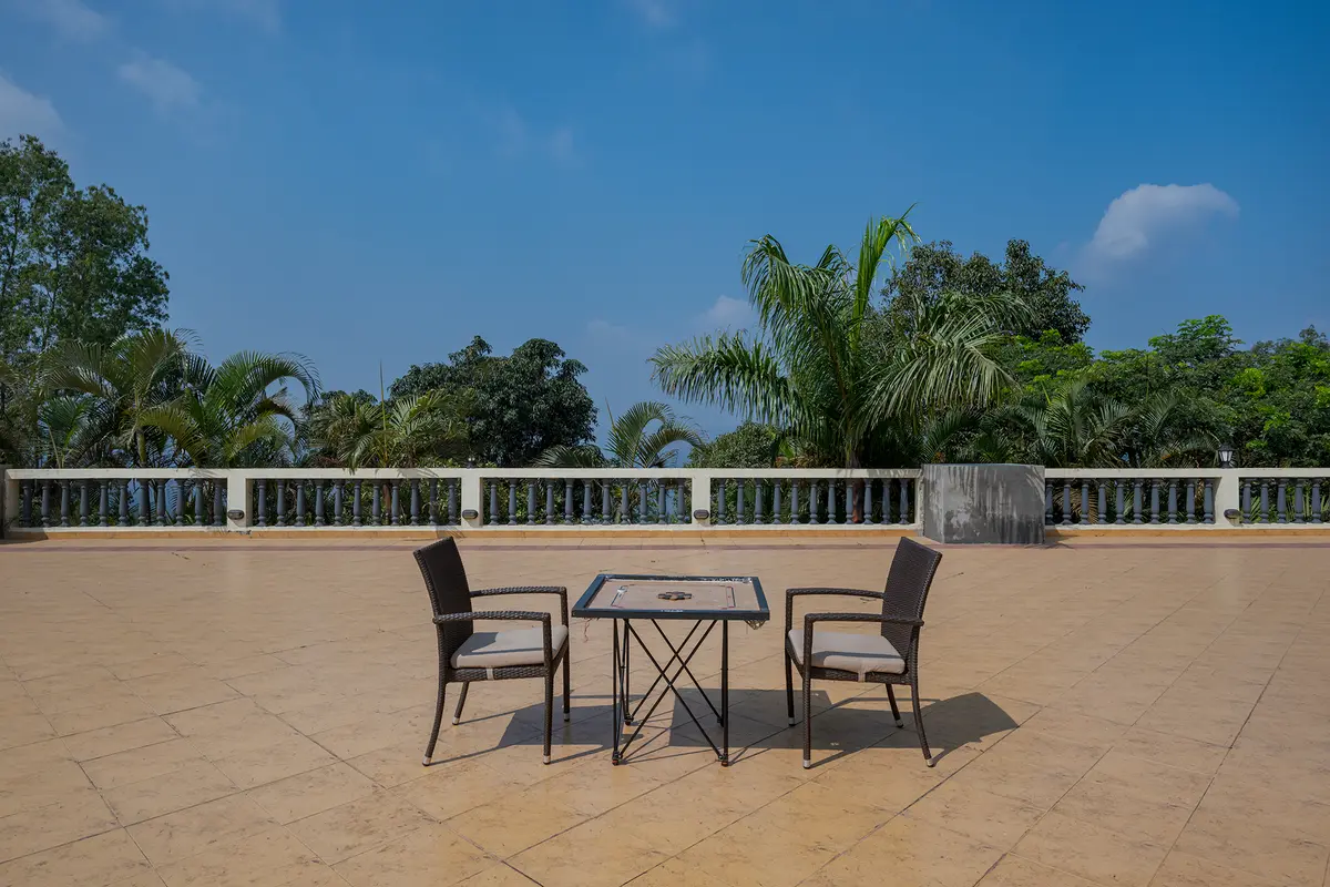 Enjoy a fun game of carrom on the rooftop while taking in 360° views of Panchgani’s valleys and lush treetops.
