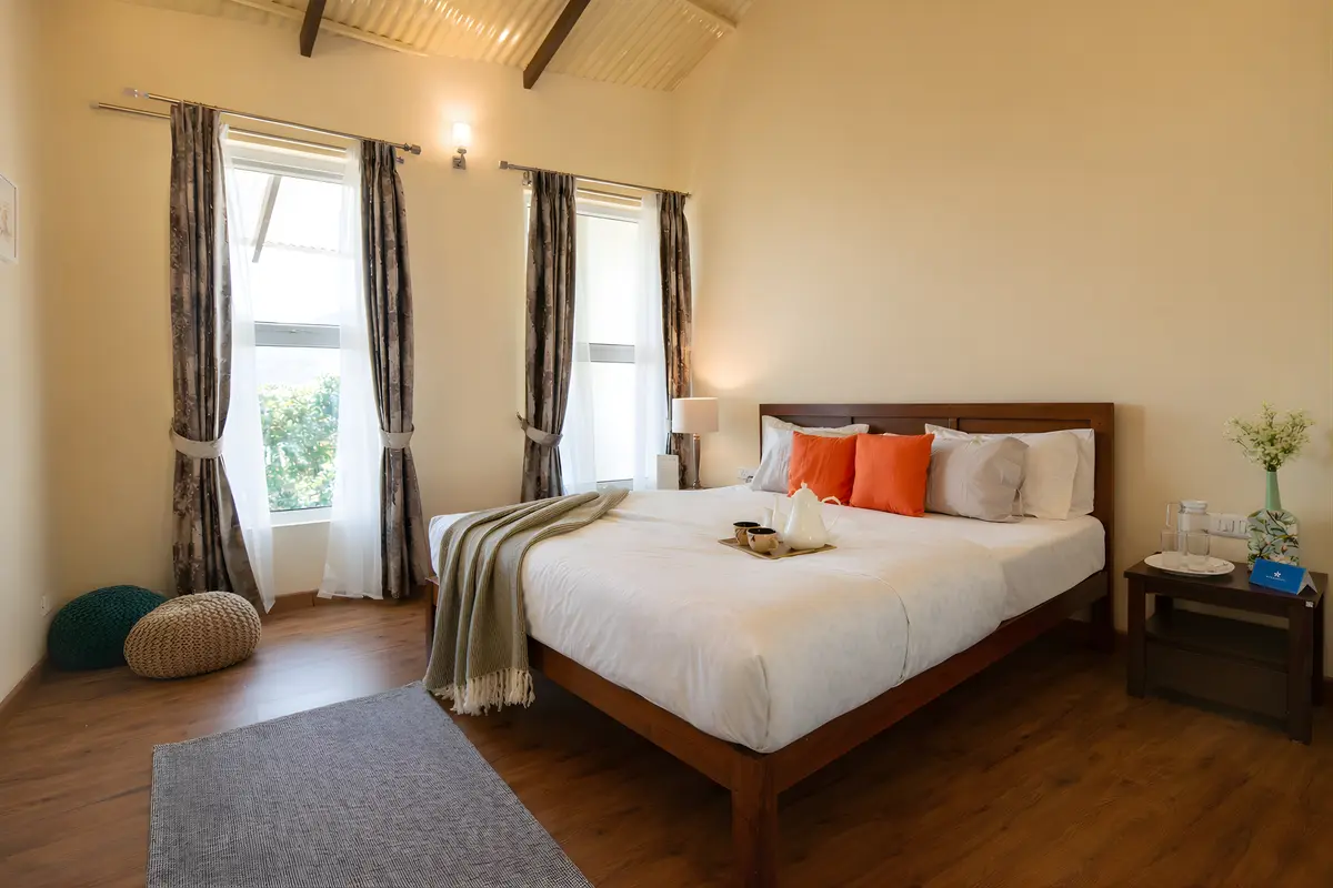 A bedroom made for lingering, soft light, and nothing on the agenda but rest.