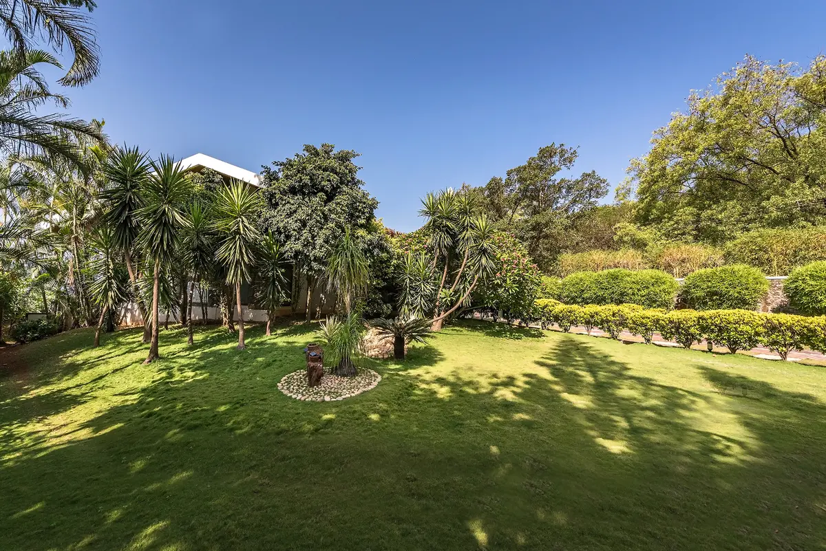 A sprawling lawn at Lakeside with manicured gardens, vegetable patches, and fruit trees to wander through.