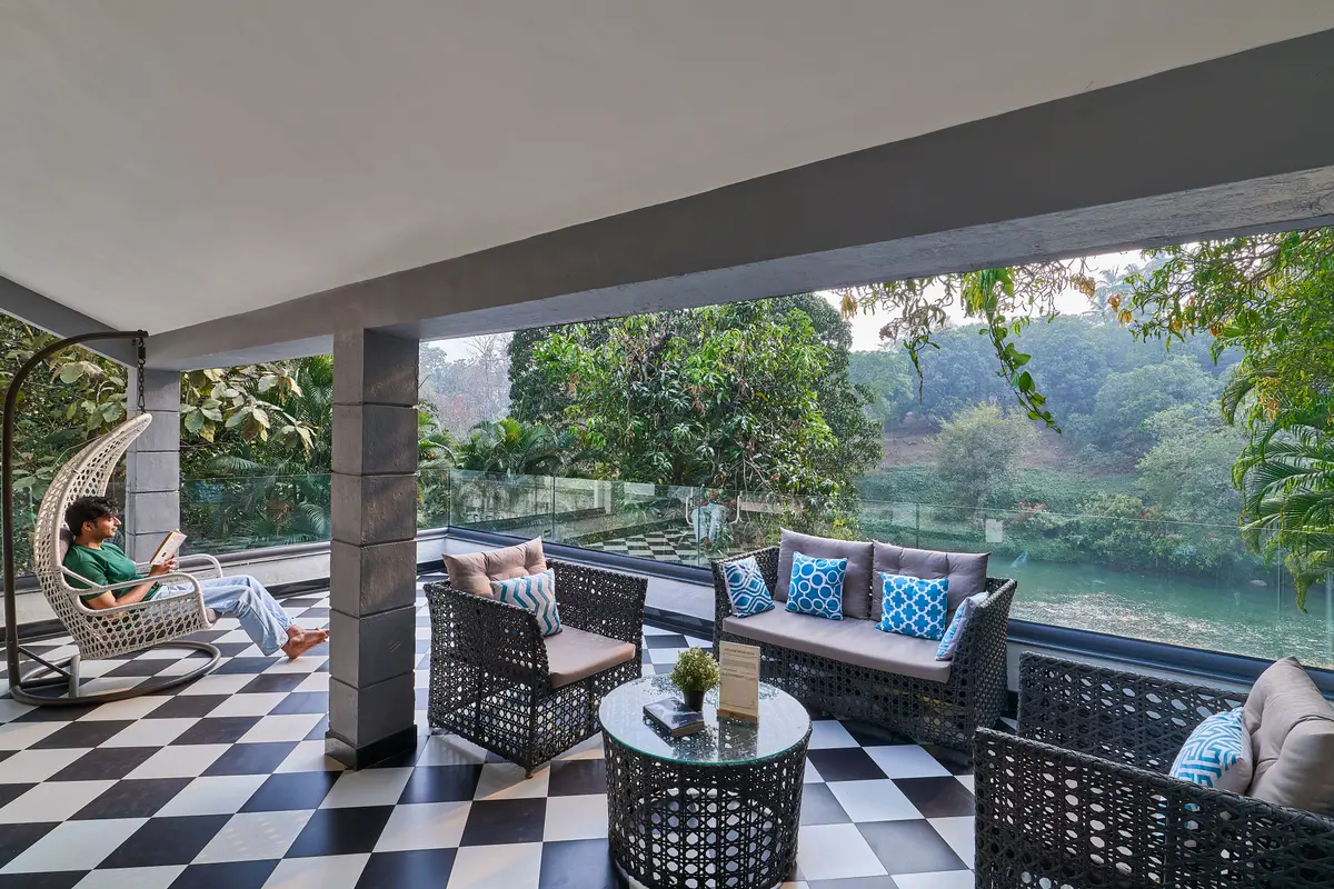 Have a moment of calm while reading booking with river view.