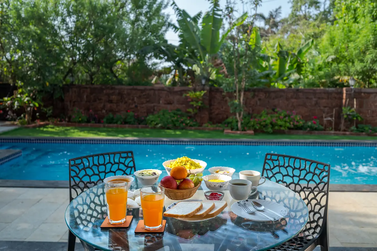 Enjoy an al fresco breakfast by the pool, surrounded by the fresh air of the hills
