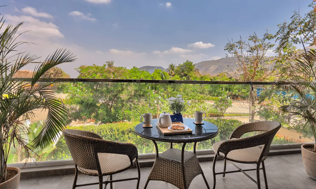 Start your day with a soothing cup of tea on the balcony, overlooking uninterrupted mountain views.