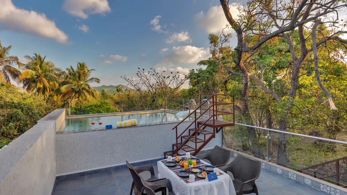 Enjoy a relaxed sunset high tea on the rooftop with poolside seating and beautiful mountain views