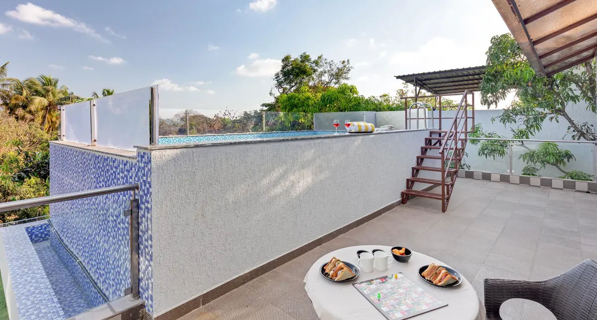 Enjoy a relaxed sunset high tea on the rooftop with poolside seating and beautiful mountain views