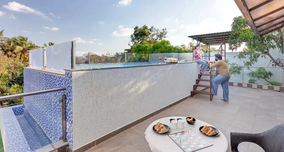 Enjoy a relaxed sunset high tea on the rooftop with poolside seating and beautiful mountain views
