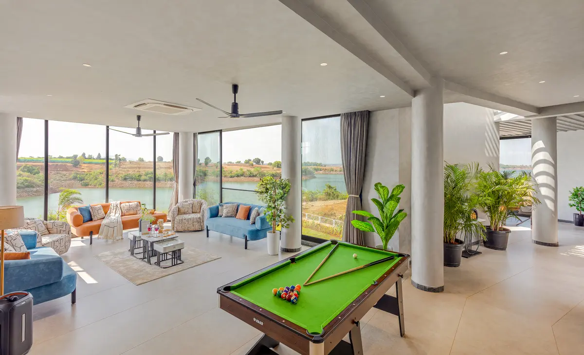 Gather around for friendly games and lively conversations with a pool table thoughtfully placed at the heart of the living room.
