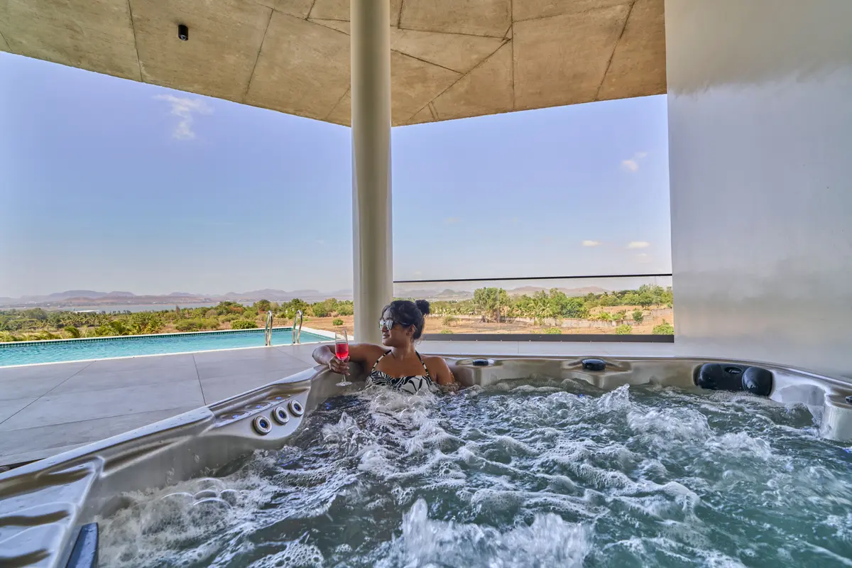 Surrounded by open skies and gentle breezes, the infinity pool and separate jacuzzi invite moments of pure relaxation