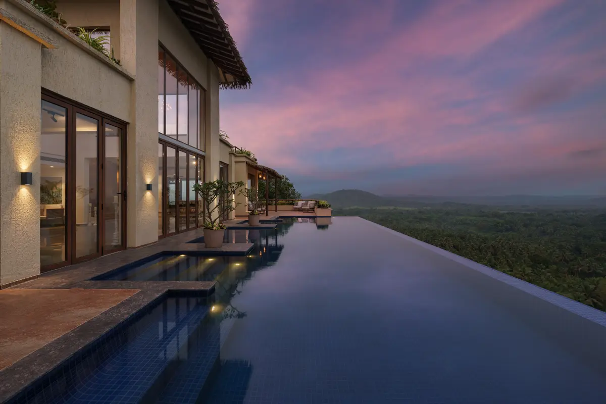 Swim in a heated infinity pool with panoramic views of the Malkarne hills.