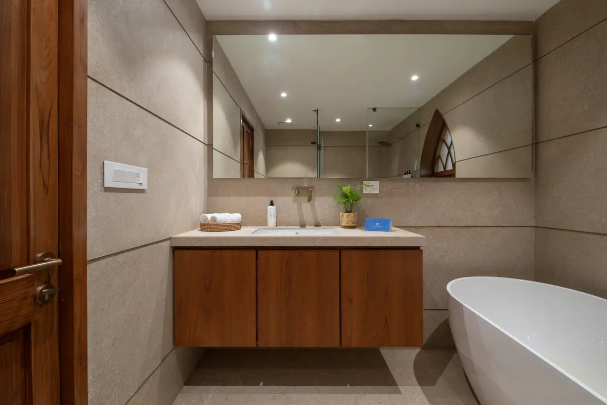 A spacious ensuite with a freestanding bathtub.