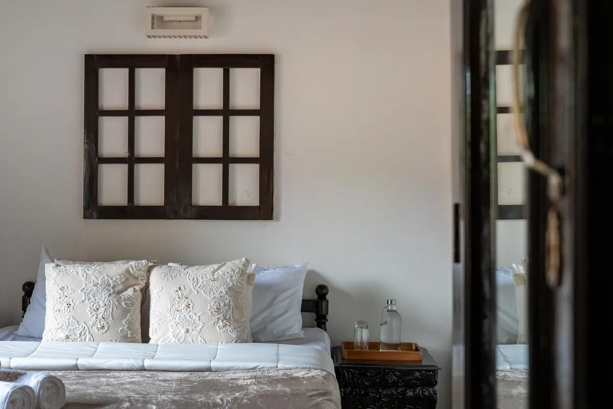 Spacious bedrooms with serene views of the gardens.