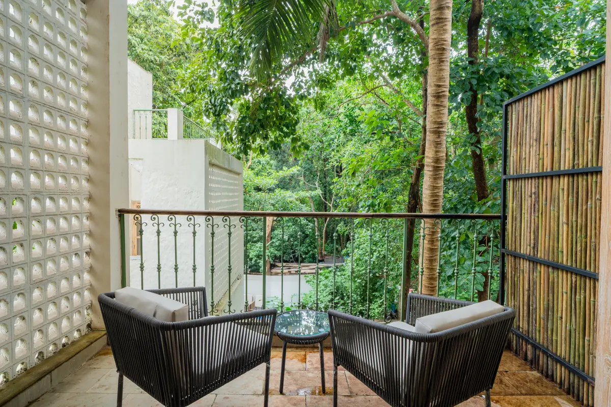 A quiet balcony overlooking the surrounding foliage.