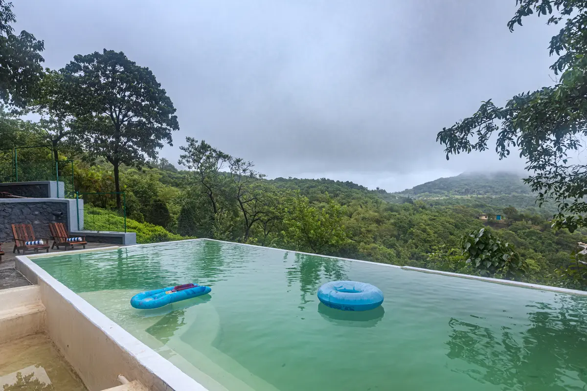 Splash in the aqua green waters of the infinity pool with a majestic view of the mountains!