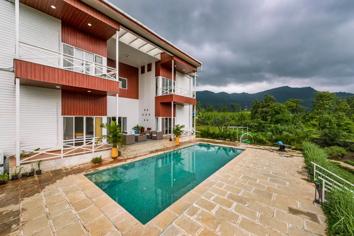 Dip in the pool surrounded by greenery