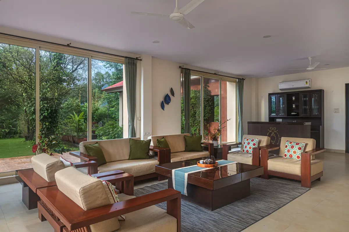 Lounge in the living room as you watch the natural light seep in from the floor to ceiling windows.